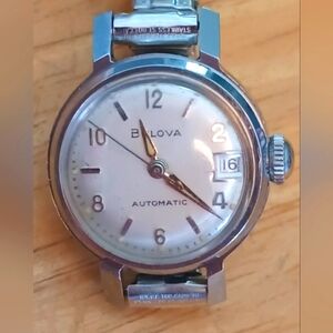 X 1968 Bulova automatic silver tone case 3 Hand movement, Date Arabic Numerals
